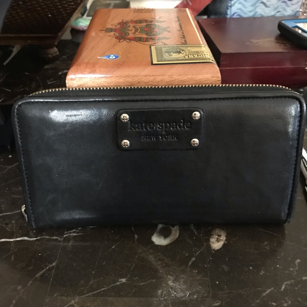 Black Kate Spade Wallet. Lots of rooms inside.